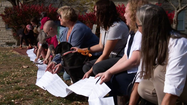 A petition with over 5,500 names stretched around the statue of Alfred Kinsey and onto the lawn around him.  - Devan Ridgway / WFIU-WTIU