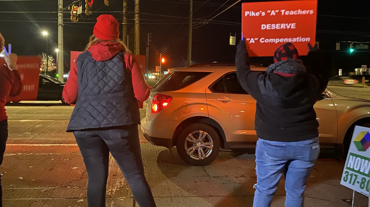 Pike Township Schools teachers and families stand outside Central Elementary School before a school board meeting on Thursday, Nov. 11, 2011. They rallied in support of teacher pay raises beyond the district’s current offer. - (Elizabeth Gabriel/WFYI)