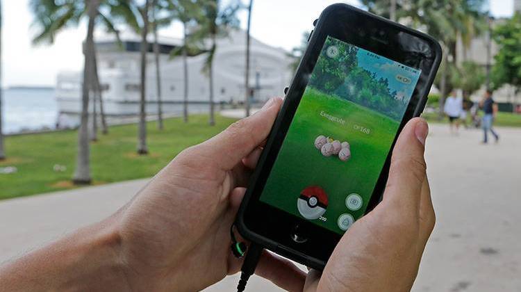 Exeggcute, a Pokemon, is found by a Pokemon Go player, Tuesday, July 12, 2016, in Miami.  - AP Photo/Alan Diaz