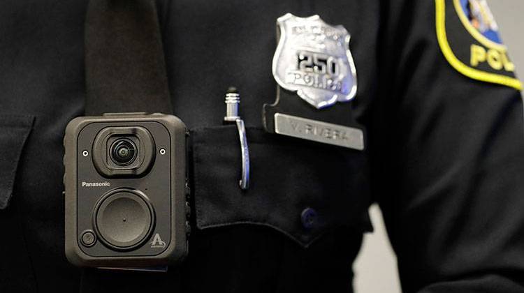 FILE - In this April 26, 2017 file photograph, a Newark, N.J. police officer displays how a body cam is worn during a news conference in Newark. - AP Photo/Julio Cortez, File