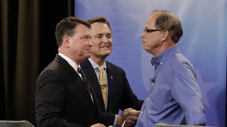 Senate candidates Todd Rokita, , from left, Luke Messer and Mike Braun speak with each other following the Indiana Republican Senate Primary Debate, Monday, April 30, 2018, in Indianapolis. - AP Photo/ Darron Cummings, Pool