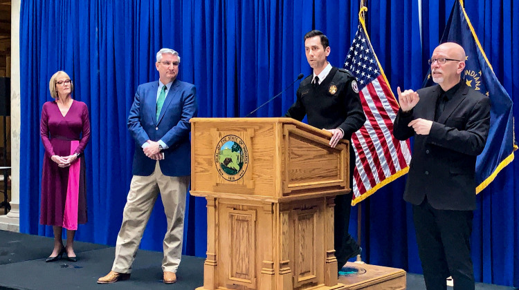 Gov. Eric Holcomb, second from left, and other officials give updates on the state's COVID-19 response. - Brandon Smith/IPB News