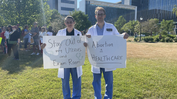 Dr. Kristen Swanson and Dr. Petr Silva attended a rally at the IUPUI medical campus on June 29 to show their support for abortion rights. They said the government should not make medical decisions. - Darian Benson/WFYI News