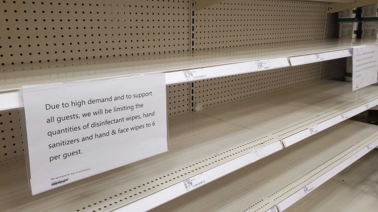 Shelves sit empty at a Target in the Indianapolis area with signs informing customers of limits on the number of products they can buy at a time.  - Samantha Horton/IPB News