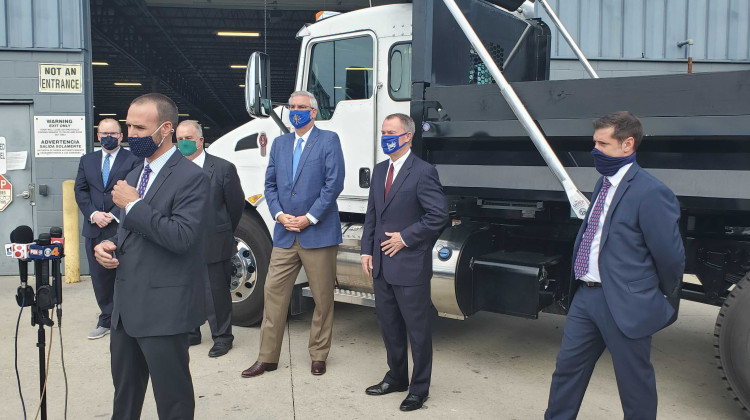 Palmer Trucks CEO John Nichols discusses the company's decision to expand during the coronavirus pandemic with Gov. Eric Holcomb, Indianapolis Mayor Joe Hogsett and other officials in attendance. - Samantha Horton/IPB News