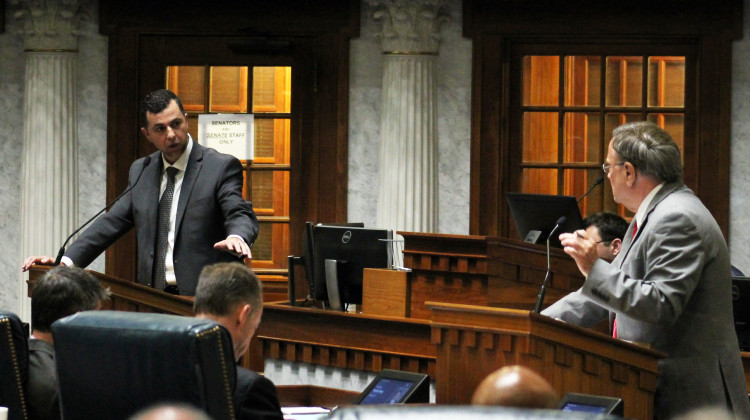 Sen. Fady Qaddoura (D-Indianapolis), left, and Sen. Mike Young (R-Indianapolis) debate Young's proposal to eliminate rape and incest exceptions for abortion during a Senate floor session on July 28, 2022. - Brandon Smith/IPB News