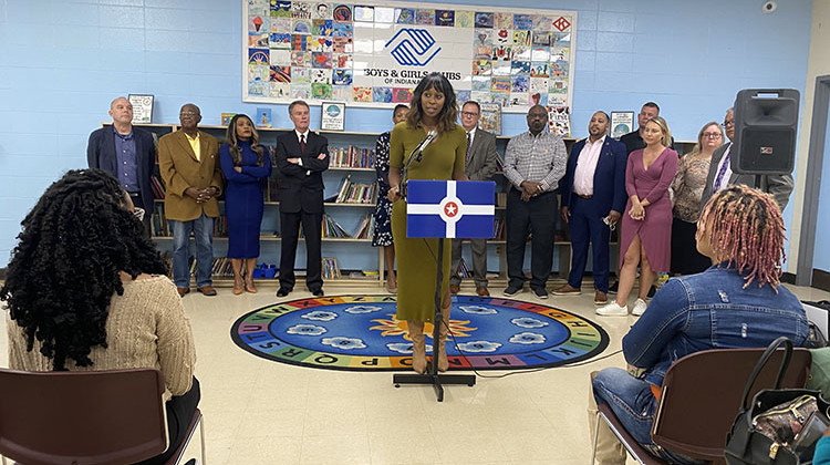 Jasmin Shaheed-Young, RISE INDY president, stands among community members as they announce the Circle City Readers initiative. - Elizabeth Gabriel/WFYI News