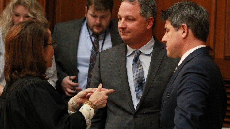 Indiana House Speaker Todd Huston (R-Fishers), center, and Senate President Pro Tem Rodric Bray (R-Martinsville), right, speak with Indiana Chief Justice Loretta Rush, left on the House floor prior to the State of the State address on Jan. 10, 2023.  - Brandon Smith/IPB News