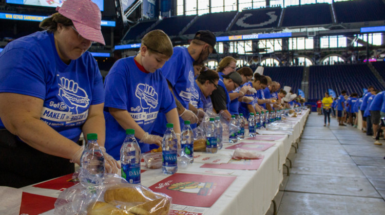 Over 2,000 volunteers gathered in Lucas Oil Stadium today in an attempt to break the Guinness World Record for simultaneous sandwich-making. - Evan Robbins/WFYI