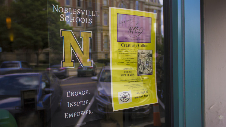 A poster for Noblesville Schools hangs in a coffee shop window.  - FILE PHOTO: Peter Balonon-Rosen/IPB News