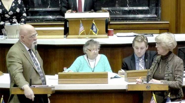 Reps. Tim Brown (R-Crawfordsville) and Sue Errington (D-Muncie) discuss the to-be-appointed Muncie school board on the House floor Wednesday evening - Indiana General Assembly