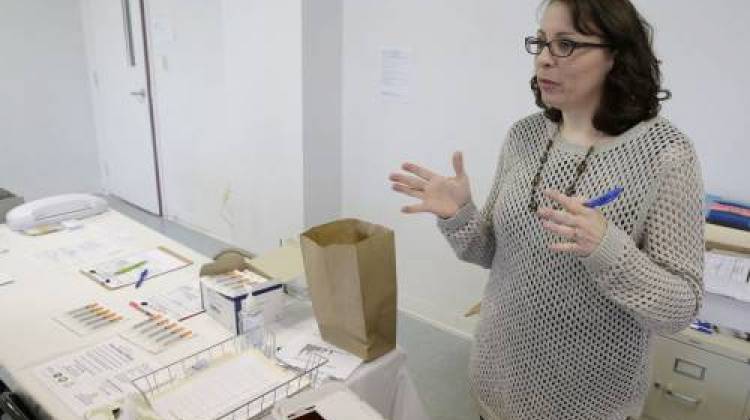 Scott County Health Department Public Health Nurse Brittany Combs talks about the needle exchange program at the Austin Community Outreach Center, Tuesday, April 21, 2015, in Austin, Ind.  - The Associated Press