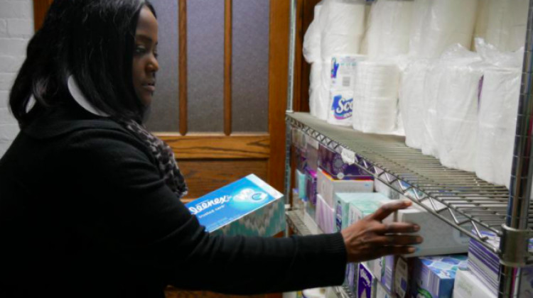 Jacqueline Willet of Coburn Place looking at supplies they use to stock up transitional housing units that survivors move into with their children. - Provided by Coburn Place