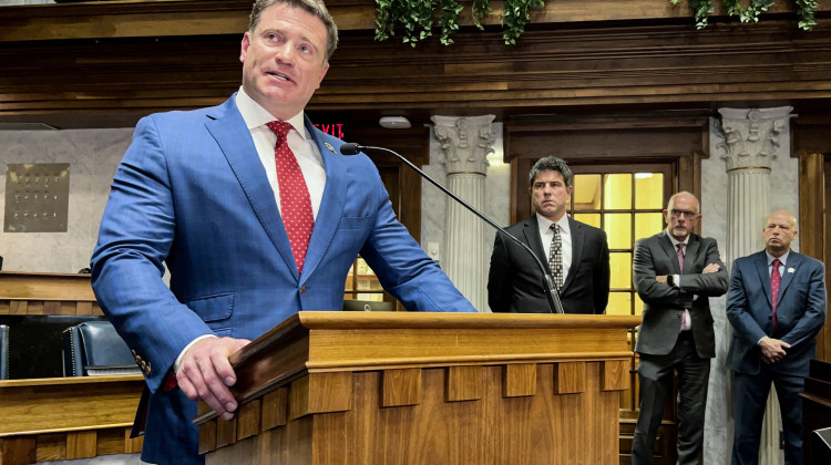 Senate Republican leaders discuss their 2023 agenda on the Senate floor. From left to right are Sen. Chris Garten (R-Charlestown), Senate President Pro Tem Rodric Bray (R-Martinsville), Sen. Travis Holdman (R-Markle) and Sen. Mike Crider (R-Greenfield). - Brandon Smith/IPB News