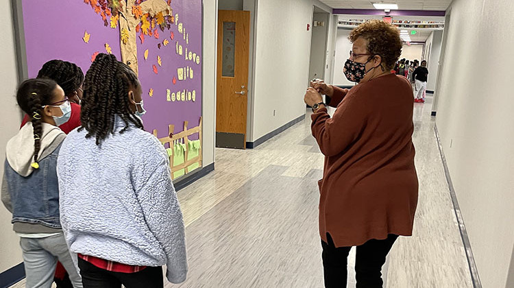 CIS Indiana site coordinator Shelia Richardson walks down a hallway with students at Winding Ridge Elementary in the MSD of Lawrence Township School district.  - (Submitted photo)