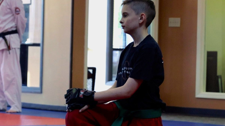 Skyler Wampler listens to directions at a martial arts lesson in Bloomington. - Lauren Tucker / WFIU