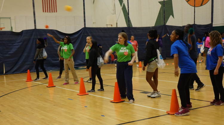 IPS students throw balls as far as they can during the district's second Special Olympics Unified Games.  - Emily Cox/WFYI