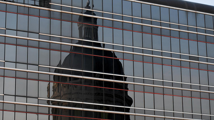 The reflection of the Indiana Statehouse in a nearby building.  - Justin Hicks/IPB News