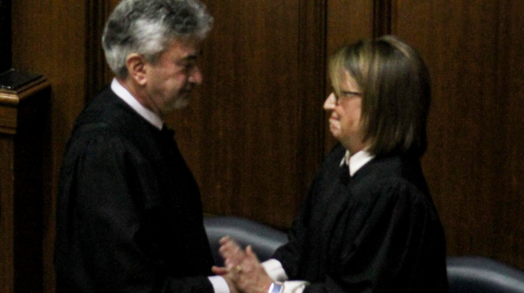 Chief Justice Loretta Rush, right, invited retiring Justice Steven David, left, to help her deliver her annual State of the Judiciary address. - Brandon Smith/IPB News