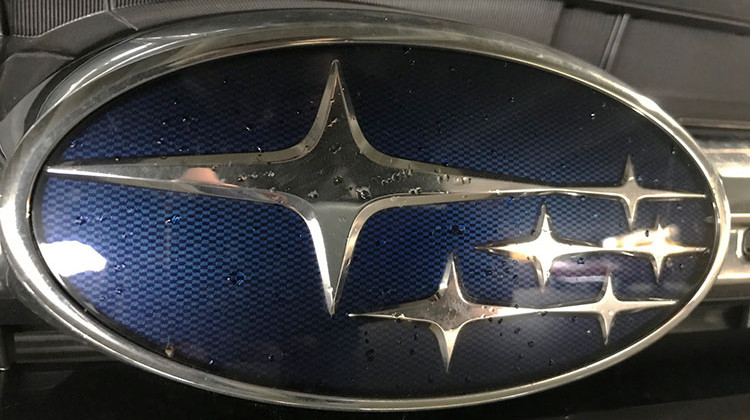 A Subaru badge on the front of a 2018 Outback. The automaker is recalling about 229,000 Outback and Legacy vehicles in the U.S. from the 2018 model year. - Doug Jaggers/WFYI