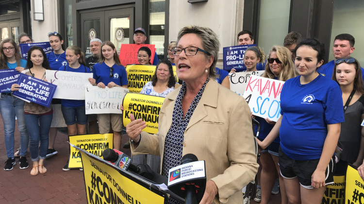 Susan B. Anthony List Indiana chair Sue Swayze Liebel leads a demonstration outside the Indianapolis office of Sen. Joe Donnelly (D-Ind.). - Brandon Smith/IPB News