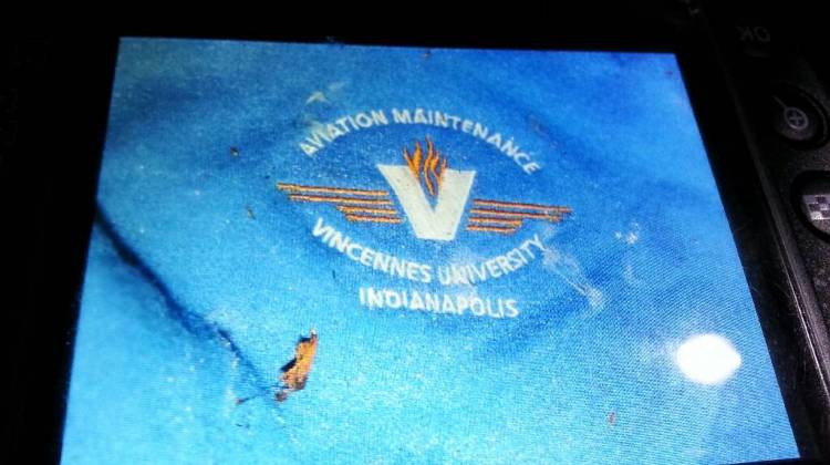 The blue sweatshirt reads "Aviation Maintenance Vincennes University-Indianapolis".  - IMPD