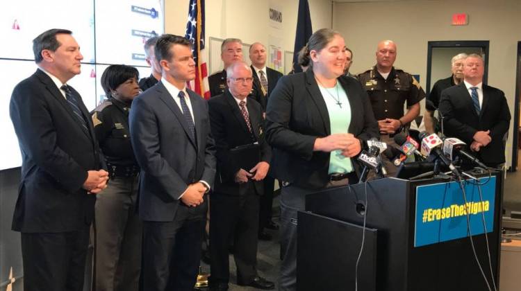 Lebanon, Ind. police officer Taylor Nielsen discusses her struggle with mental health issues while Senator Joe Donnelly (D-Indiana), at far left, and Senator Todd Young (R-Indiana), right of Donnelly, listen. - Brandon Smith/IPB