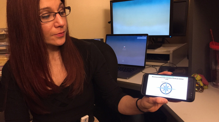 Indiana University School researcher Dawn Neumann demonstrates the My Emotional Compass app.  - Jill Sheridan/IPB News