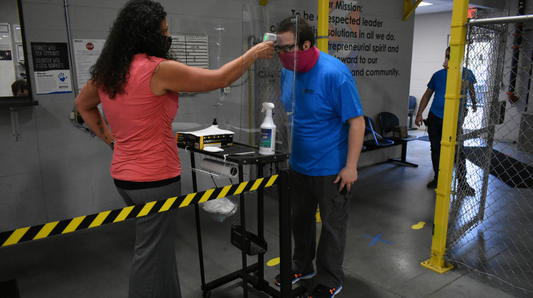 Employees at a northern Indiana company get their temperatures checked as part of a screening protocol to prevent COVID-19 infections.  - Justin Hicks/IPB News