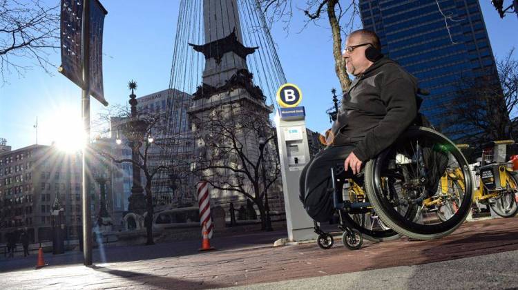 Richard Propes on lap 77 of 122 around Monument Circle on Saturday, Jan. 2, 2016 in his wheelchair to draw attention to the problem of violence against children. - Ryan Delaney/WFYI