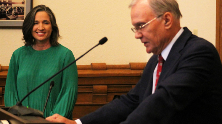 Indiana State Auditor Tera Klutz looks on as Office of Management and Budget Director Cris Johnston discusses the closeout of the state's 2022 fiscal year.  - Brandon Smith/IPB News