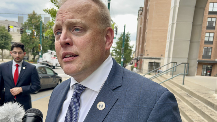 Indiana Solicitor General Thomas Fisher speaks to reporters outside the Monroe County Court building after a hearing on the first lawsuit challenging Indiana's near-total abortion ban on Sept. 19, 2022. - Brandon Smith/IPB News