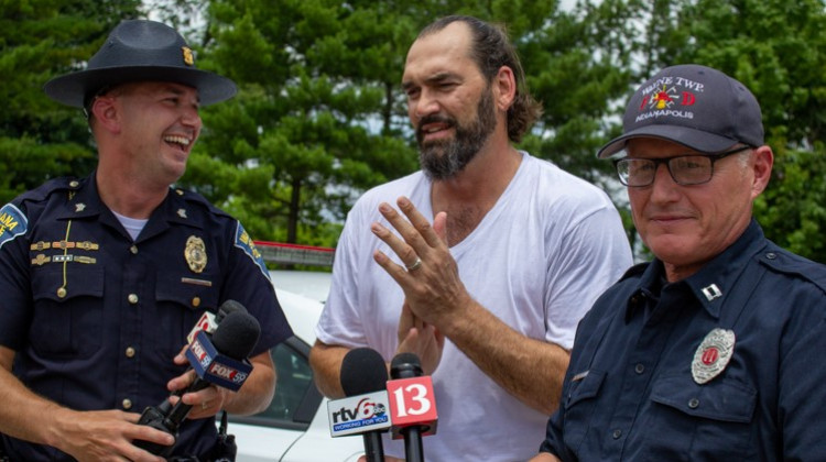 [L-R] Indiana State Police Sergeant John Perrine, retired NBA player Scot Pollard, and Wayne Township Fire Department Captain Mike Pruitt after getting out of the 112 degree car. - Evan Robbins/WFYI