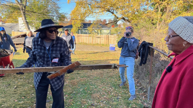 Marion County Public Health Department Director Dr. Virginia Caine (left) volunteers at the home of Paula Stevens (right). - Jill Sheridan/WFYI