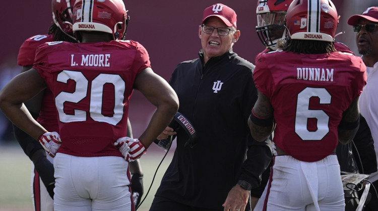 Indiana head coach Tom Allen talks with the defense during the second half of an NCAA college football game against Wisconsin, Saturday, Nov. 4, 2023, in Bloomington, Ind. - AP Photo/Darron Cummings