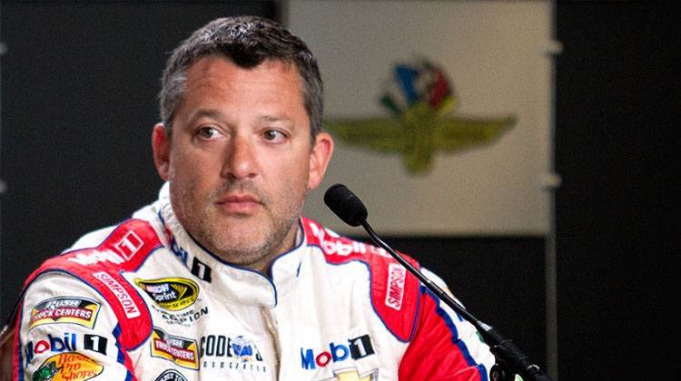 Columbus, Indiana native Tony Stewart, shown here talking to reporters before the 2016 Brickyard 400, is among the seven Motorsports Hall of Fame of America Class of 2019 honorees. - Doug Jaggers/WFYI