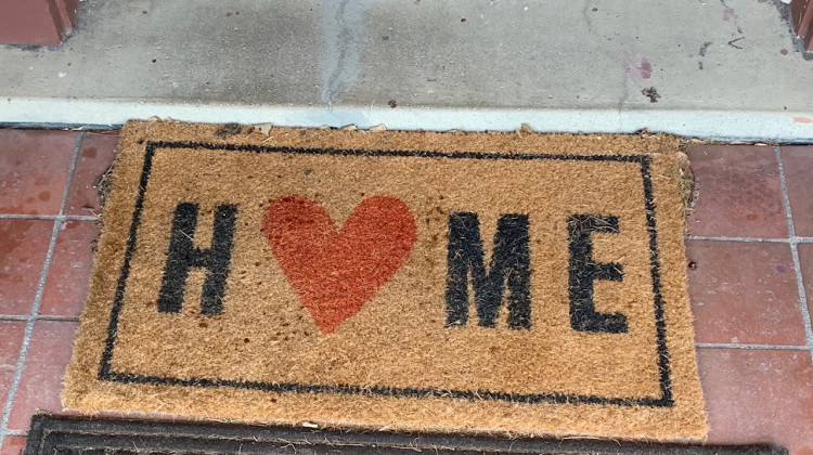 A welcome mat sits outside the front door of Trinity Haven, a new housing option in Indianapolis for LBGTQ youth experiencing homelessness. - Jill Sheridan/WFYI
