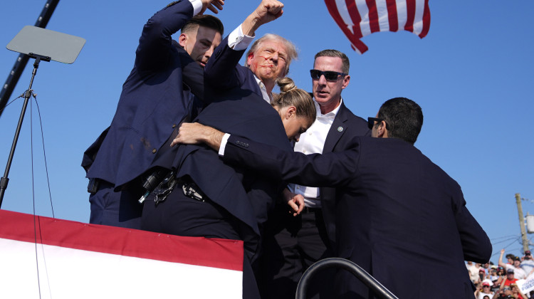 Republican presidential candidate former President Donald Trump is surrounded by U.S. Secret Service agents at a campaign rally, Saturday, July 13, 2024, in Butler, Pa. - Evan Vucci / AP Photo