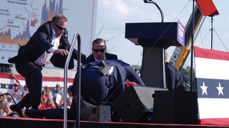 U.S. Secret Service agents converge to cover Republican presidential candidate former President Donald Trump at a campaign rally, Saturday, July 13, 2024, in Butler, Pa. - AP Photo/Evan Vucci