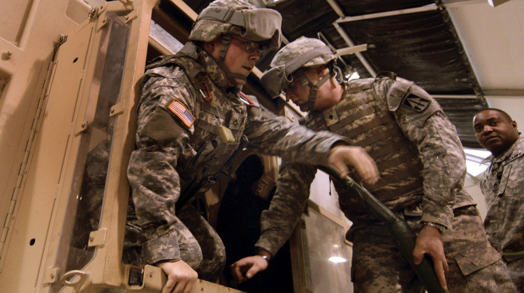 U.S. Army Soldiers of the 76th Infantry Brigade Combat Team, Indiana Army National Guard, exit from the Humvee Egress Assistance Trainer during mobilization training at the Camp Atterbury Joint Maneuver Training Center in Edinburgh, Ind., Dec. 13, 2007.  - U.S. Army photo by Staff Sgt. Russell Lee Klika/public domain
