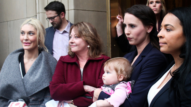 (Left to right) Former gymnasts Sarah Klein, Marcia Frederick, Rachael Denhollander and Tasha Schwikert respond to questions outside the Birch Bayh Federal Building & U.S. Courthouse.  - FILE PHOTO: Samantha Horton/IPB News