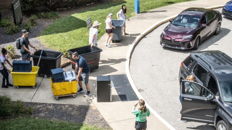 Students move into a residence hall of the University of Southern Indiana in August. The 21st Century Scholars program can offer up to free tuition for qualifying students at public universities. - Tim Jagielo / WNIN