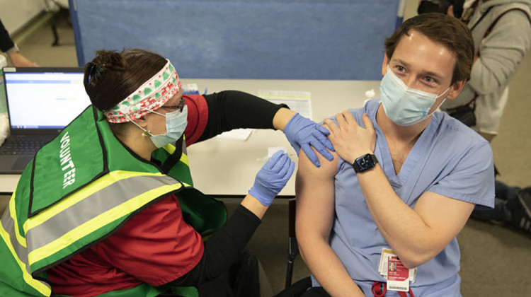 Dr. Casey Frey receives a COVID-19 vaccine in mid-December. On Jan. 21, state health officials announced they would not yet expand vaccine eligibility to the next age group.  - Provided by Indiana University Health