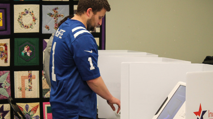 A voter casts their vote using touch screen portals during early voting at the Indianapolis Library Pike Branch on Nov. 6, 2022. - Lauren Chapman/IPB News