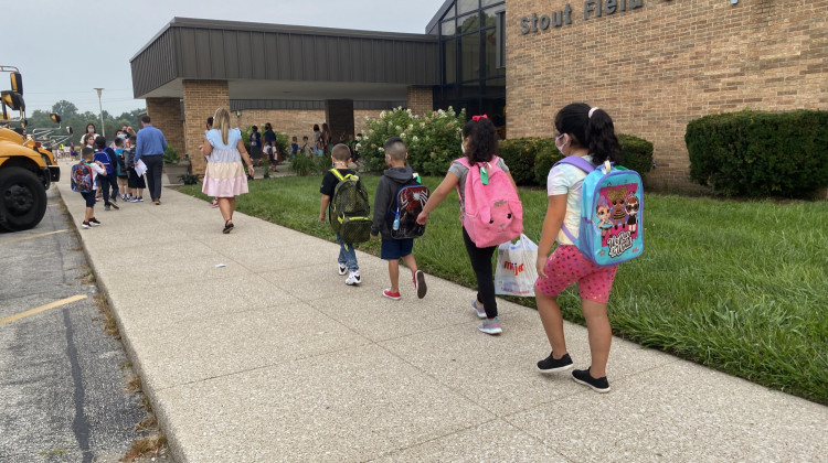 Students walk in front of Stout Field Elementary School for the first day of class at MSD Wayne Township Schools on Wednesday, July 28, 2021. - Elizabeth Gabriel/WFYI