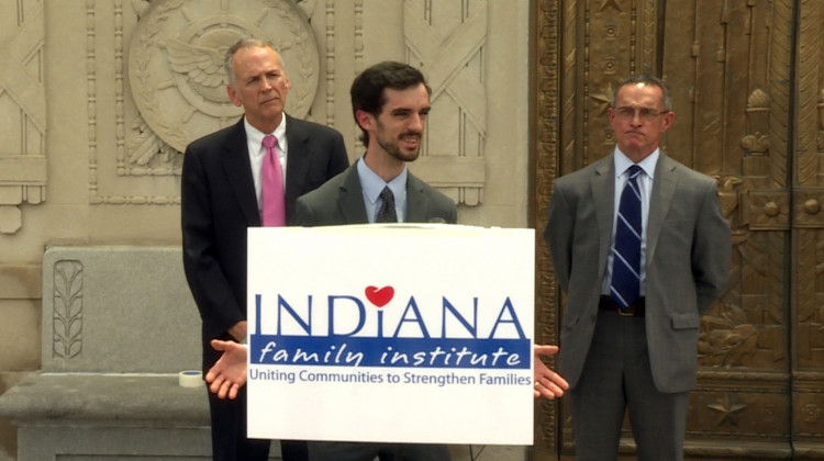 Former Brownsburg teacher John Kluge, joined by his lawyers, speaks to the press announcing the lawsuit Wednesday. - Jeanie Lindsay/IPB News