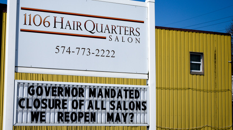 A hair salon in Nappanee displays a closure sign without a clear reopening date. The state's "Stay-At-Home" order has been extended to May 1. - Justin Hicks/IPB News