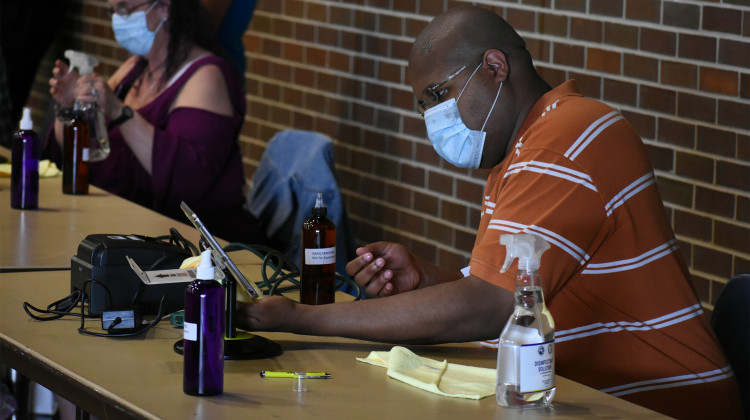 A poll worker during the May 2020 primary election in Indiana. - Indiana Public Broadcasting