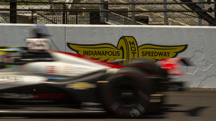 Stefan Wilson speeds past an Indianapolis Motor Speedway logo during practice for the Indianapolis 500 on Friday, May 20. - Doug Jaggers/WFYI