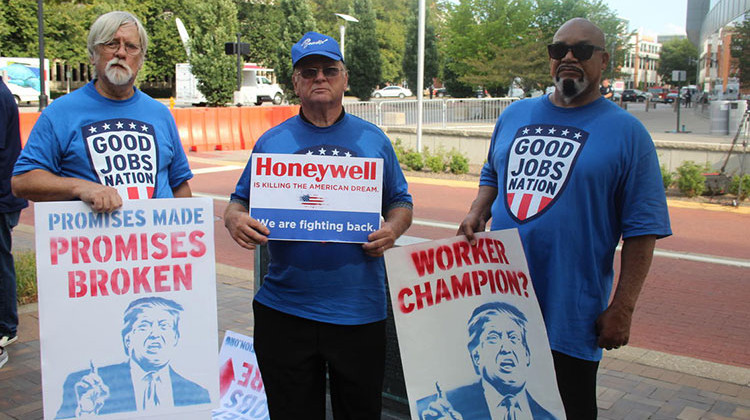 Former workers from Honeywell Aerospace in South Bend stood with the Good Jobs Nation outside President Trump's Evansville rally protesting some of his decisions that they say are negatively impacting blue collar workers. - Samantha Horton/IPB News